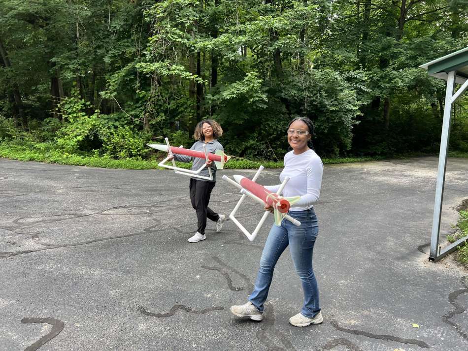 Volunteers hauling rockets